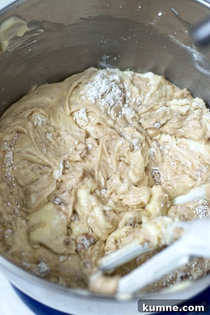 cake batter with large streaks of flour still showing