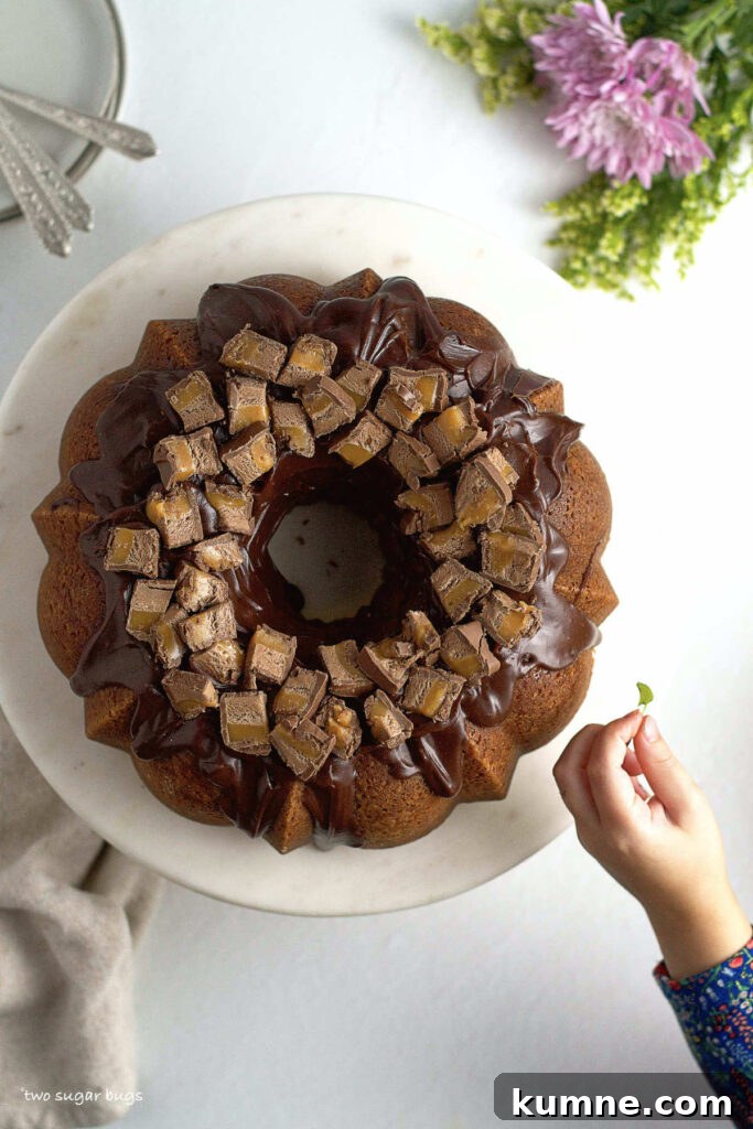 small hand reaching in for Milky Way cake