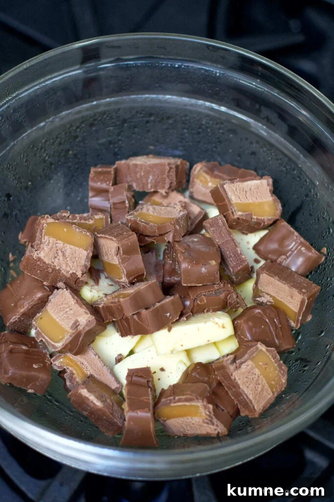 chopped Milky Way bars and butter in a pot over simmering water