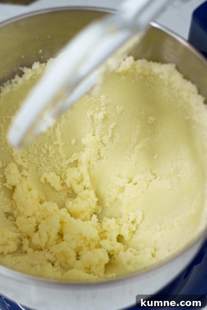 butter and sugar pressed up against the side of the mixing bowl