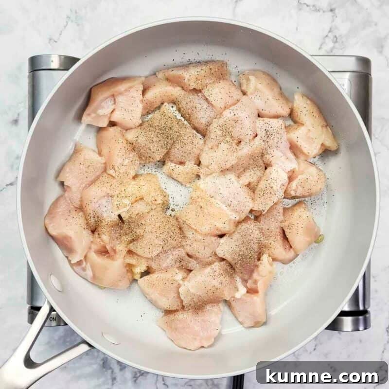 Heat the olive oil in a large skillet over medium-high heat. Add the chicken pieces to the skillet, season with salt and pepper, and cook about 5-7 minutes until the chicken is cooked through.