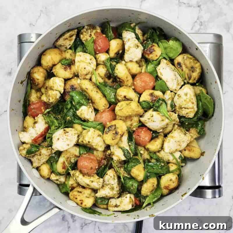 Toss until spinach wilts and pesto coats everything.