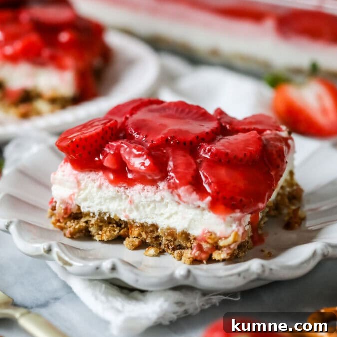 Slice of strawberry pretzel salad made completely from-scratch.