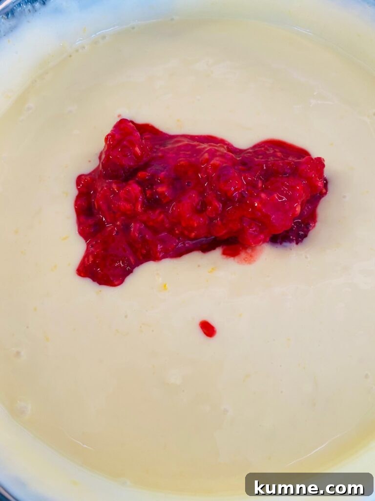 adding mashed raspberries to the pie filling