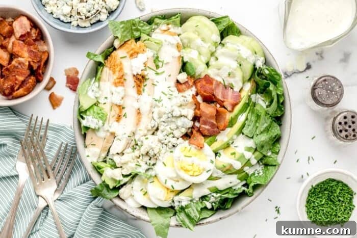 Keto Cucumber and Bacon Salad with Creamy Dill Dressing 11 overhead view of large bowl containing keto cobb salad with dressing drizzled on top