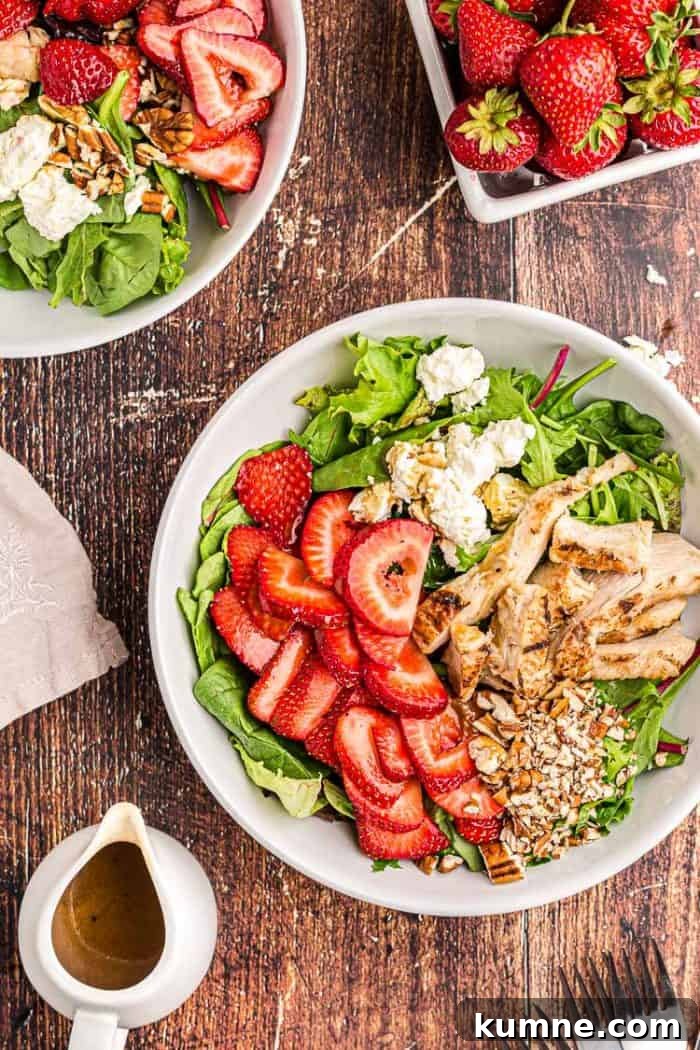 Keto Cucumber and Bacon Salad with Creamy Dill Dressing 13 overhead view of keto strawberry chicken salad next to a bowl of fresh strawberries