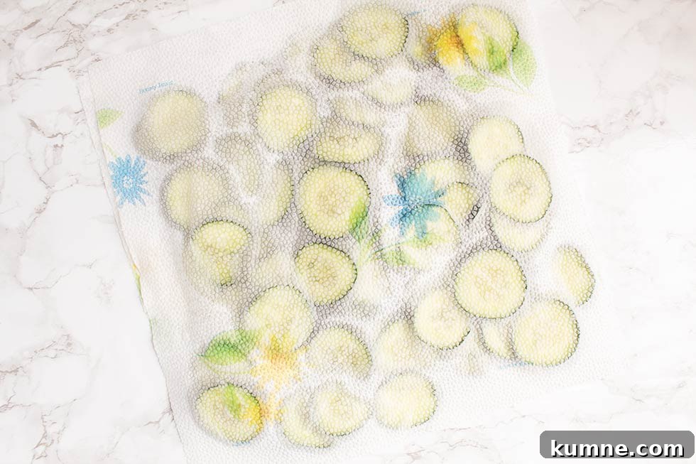 Keto Cucumber and Bacon Salad with Creamy Dill Dressing 5 paper towels covering cucumber slices to get out water