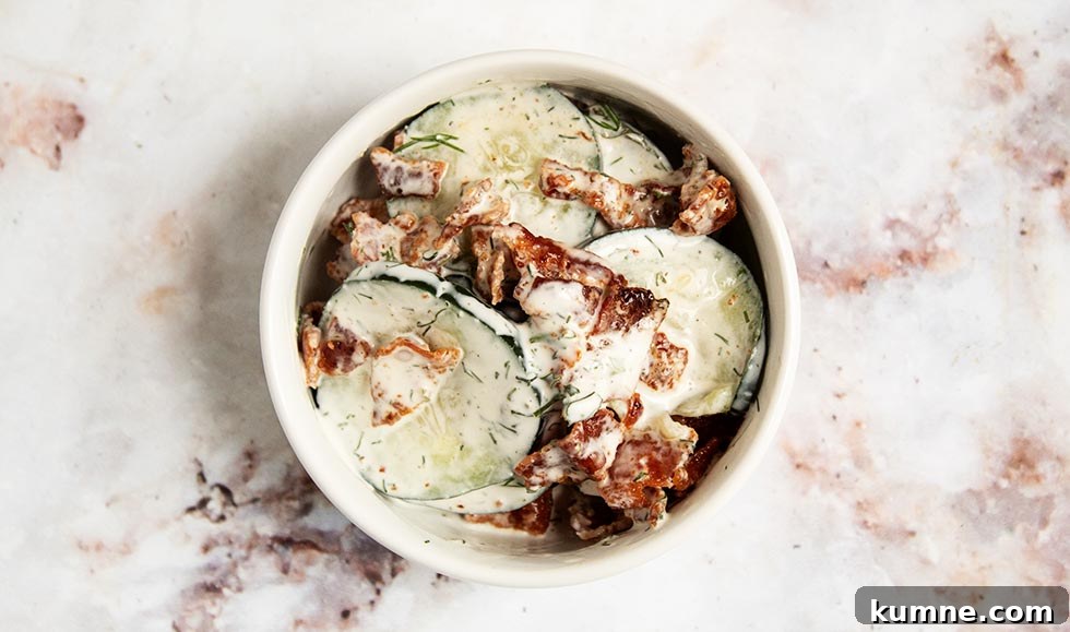 Keto Cucumber and Bacon Salad with Creamy Dill Dressing 7 overhead view of keto cucumber salad with bacon mixed in on countertop