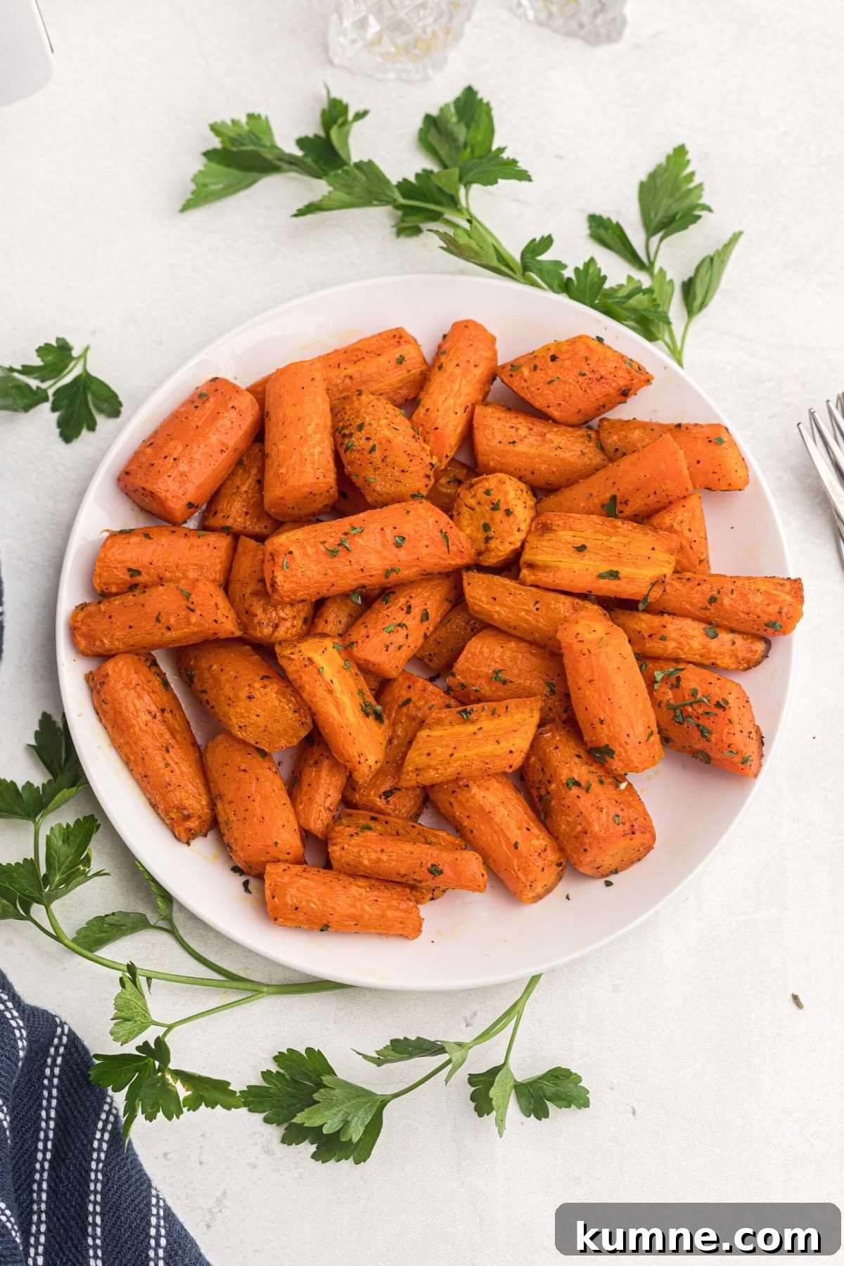 Air Fryer Carrots on a white plate ready to eat.