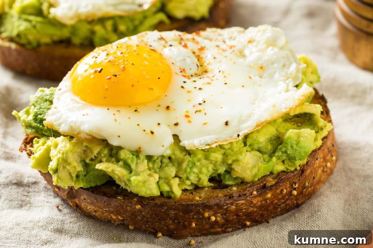 Copycat Dunkin' Avocado Toast Recipe with 3 Ingredients 10 slice of sourdough with avocado spread and a fried egg on top
