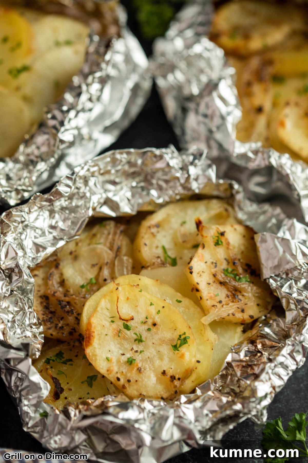 Crispy Foil-Grilled Potatoes with Garlic and Herbs 6 Potatoes in a foil pack that has been grilled