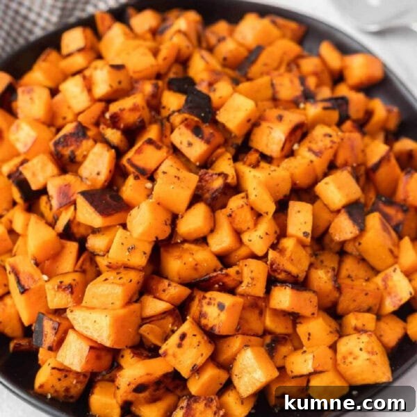 Crispy Foil-Grilled Potatoes with Garlic and Herbs 8 Diced grilled sweet potatoes on a plate.