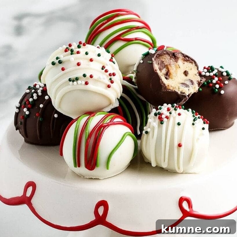 Chocolate covered cookie dough bites decorated for the holidays.