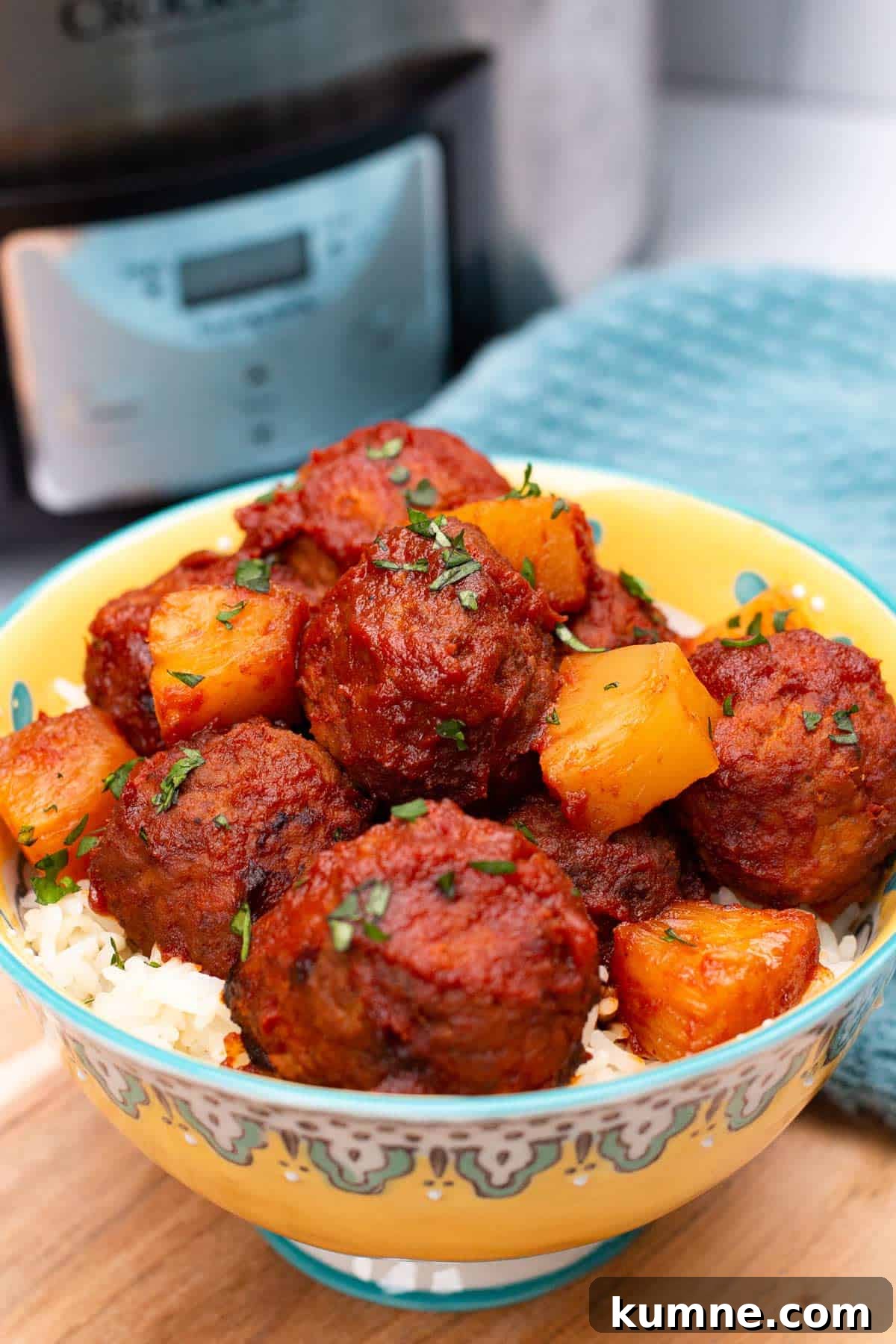 3-Ingredient Hawaiian Meatball Recipe with Pineapple Glaze 2 Hawaiian Meatballs in a bowl with an Instant Pot.