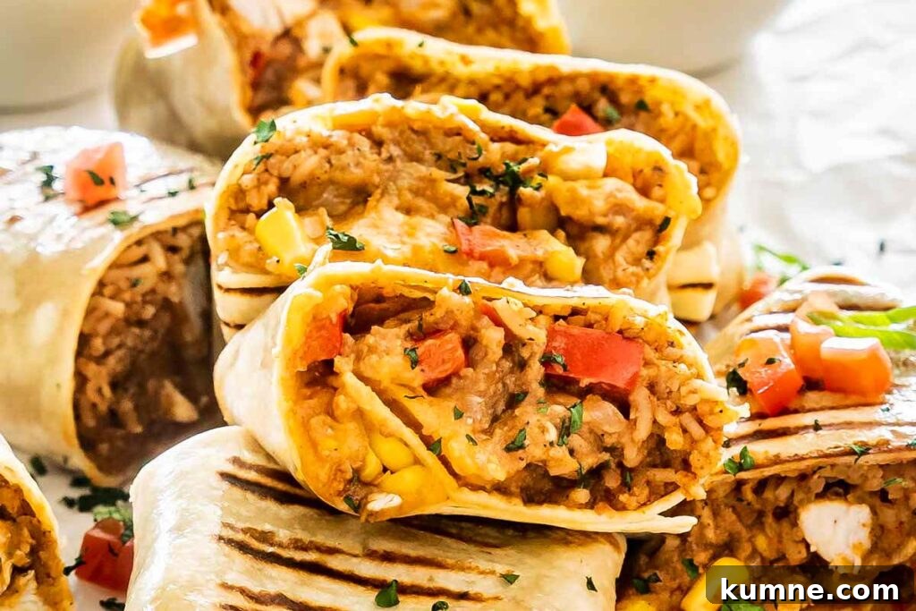 A platter with chicken burritos cut in half.