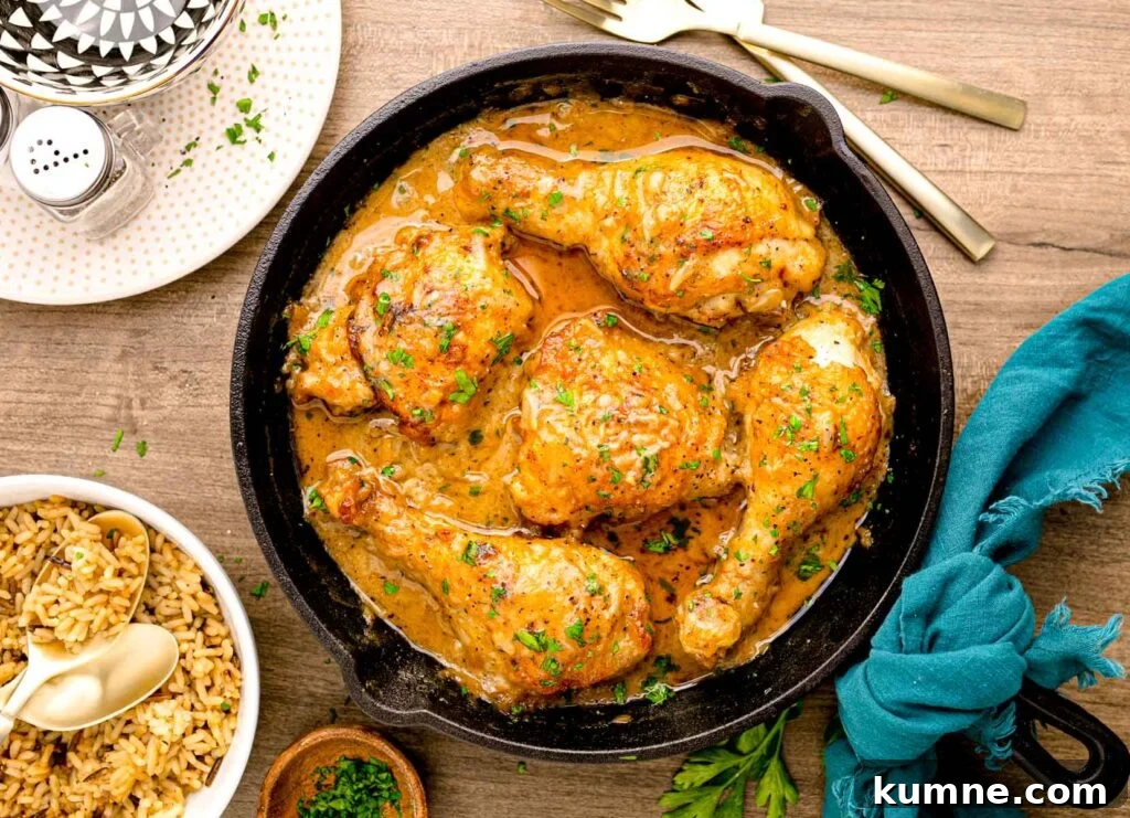 A skillet full of a chicken and gravy dish.