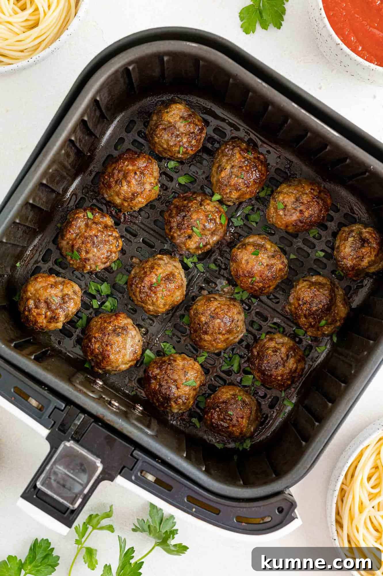 Crispy Air Fryer Italian-Style Meatballs Recipe 12 Cooked meatballs in the air fryer.