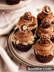 chocolate cupcakes with nutella frosting topped with ferrero rocher chocolate
