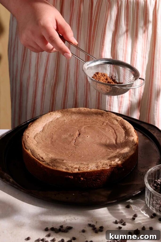 sprinkling top with cocoa powder