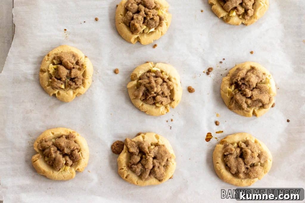 Apple Crumble Cookie Recipe — Soft Baked Fall Cookies, Step-by-Step 12 baked cookies on parchment paper
