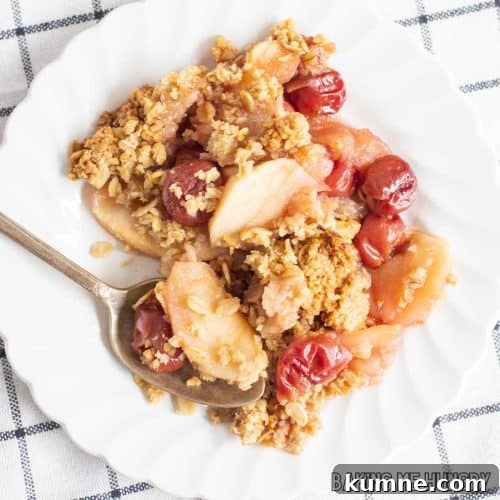 cherry apple crumble served on a small plate