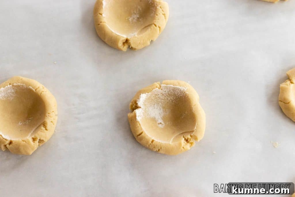 Apple Crumble Cookie Recipe — Soft Baked Fall Cookies, Step-by-Step 8 wells made in balls of dough