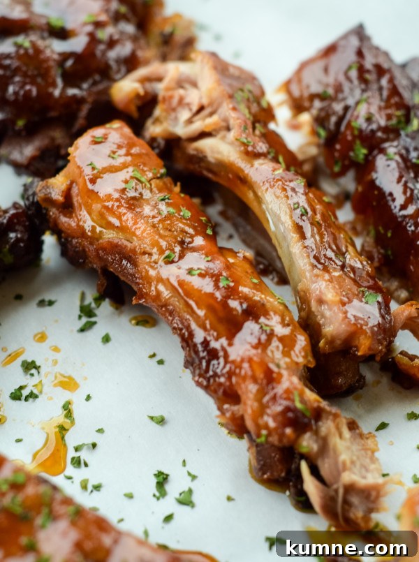 This image features slow cooker apple bbq ribs once fully cooked.