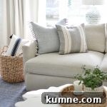12 Gorgeous Board and Batten Bedroom Wall Ideas You’ll Love 26 throw pillows on a grey couch in a living room