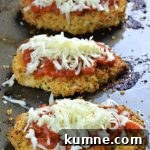 Three pieces of baked chicken parmesan