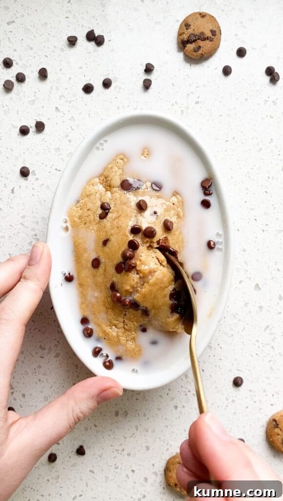 cookie dough baked oats cookie dough baked oats in white ramekin with melty chocolate chips and golden brown edges