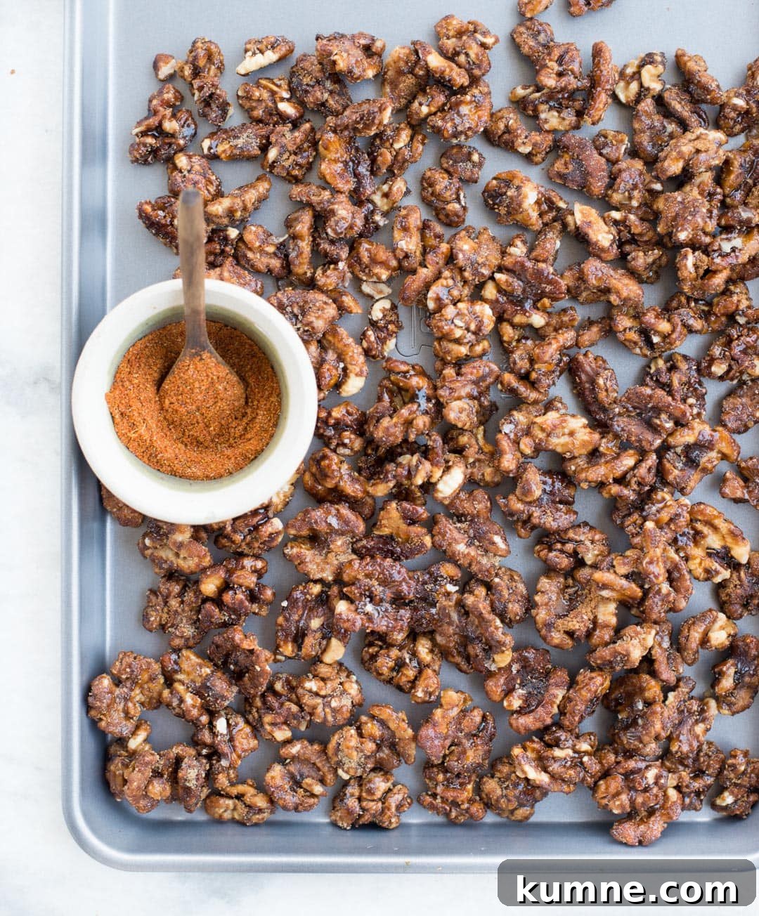 These candied walnuts are roasted with honey and spices until crunchy, then tossed in brown sugar. Honey spiced candied walnuts are addictive snacks, can be added to salads and perfect for gifting this holiday season.