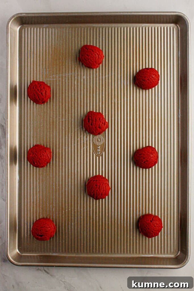 Cooke dough balls on a baking sheet on a baking sheet.
