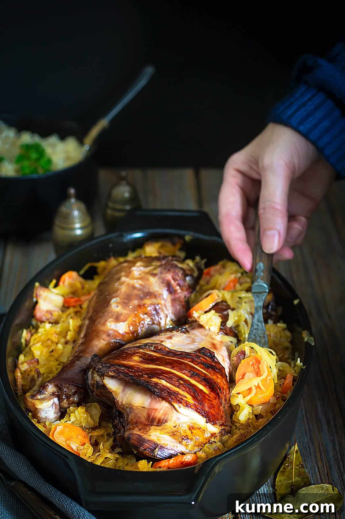 Authentic Serbian Baked Sauerkraut Recipe for Savory Comfort 5 A person serving sauerkraut dish