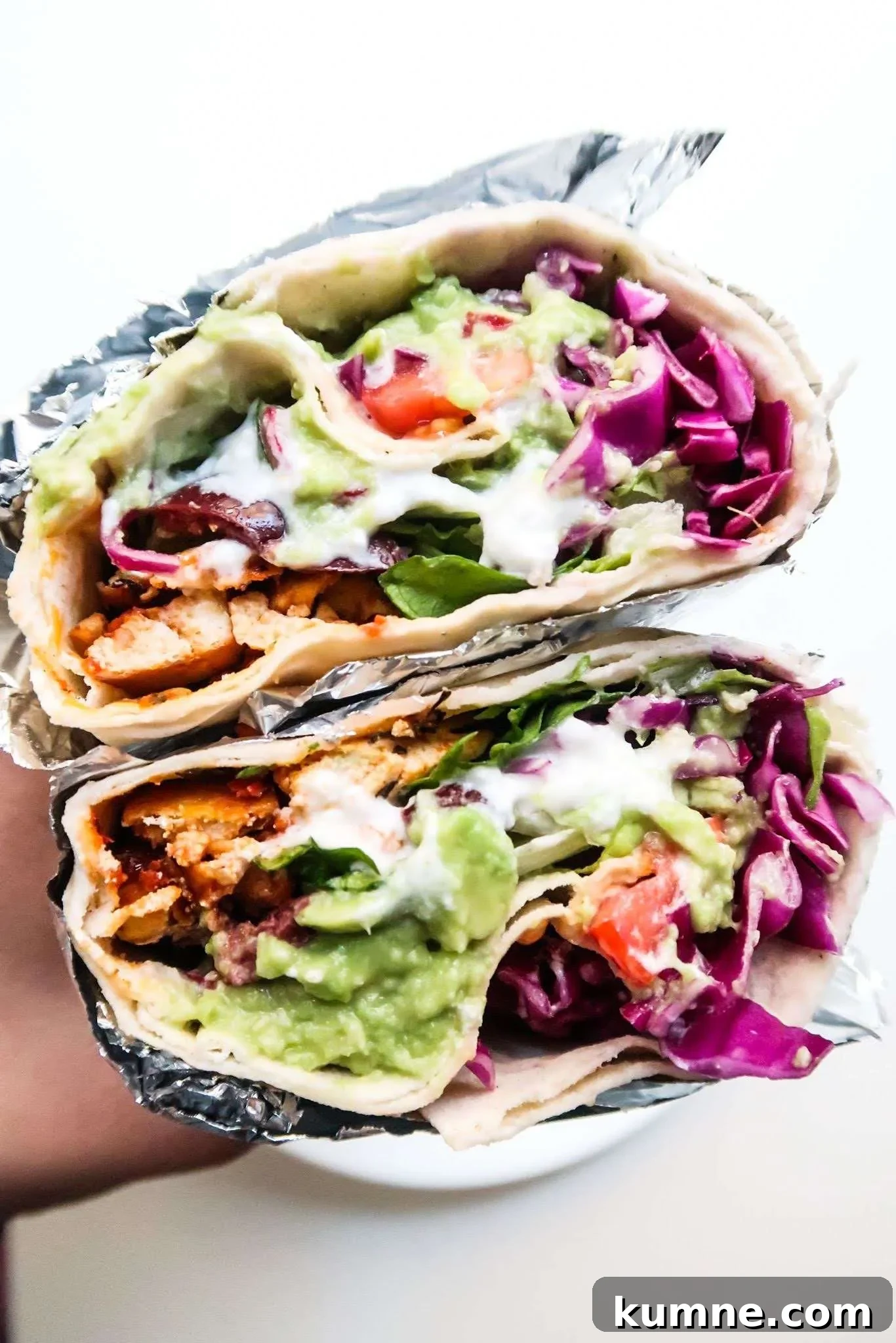30-minute vegan tofu wraps recipe - amazing vegan dinner recipe, super delicious, healthy vegan meal that is high in protein and super satisfying. This meatless dinner is great for you even if you’re not on a plant-based diet. Filled with healthy vegetables, avocado, garlicky sauce and spicy tofu this tofu recipe has become a favorite in our family! This easy vegan dinner comes also with a simple meal prep option.