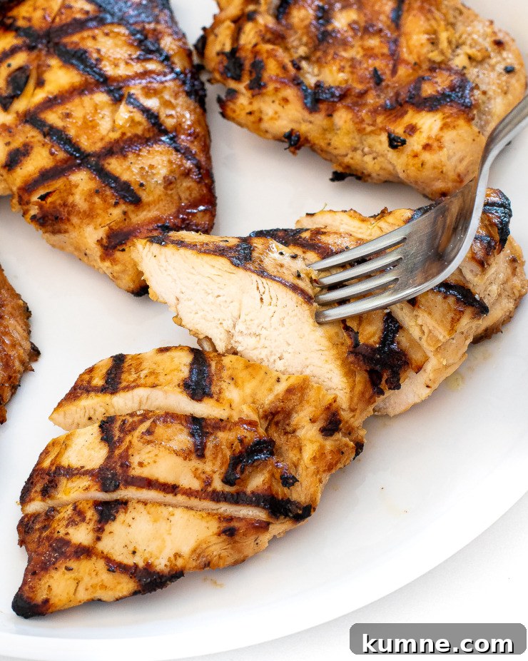 More grilled chicken on a board