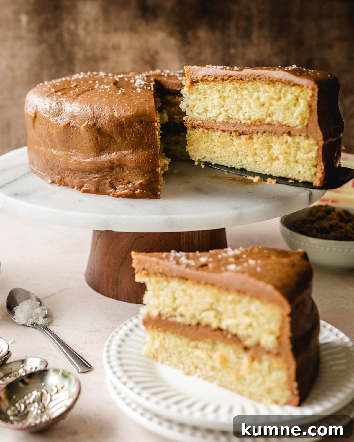 Serving a big slice of fluffy salted caramel frosting.