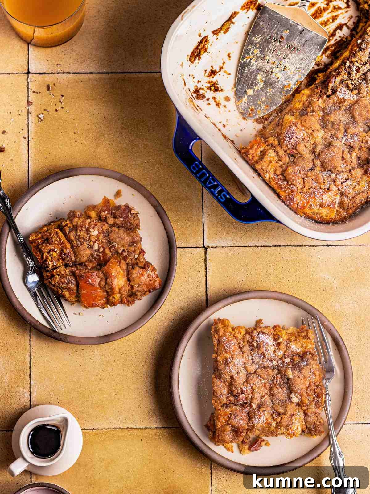 Servings of the toast in a small plate with maple syrup.