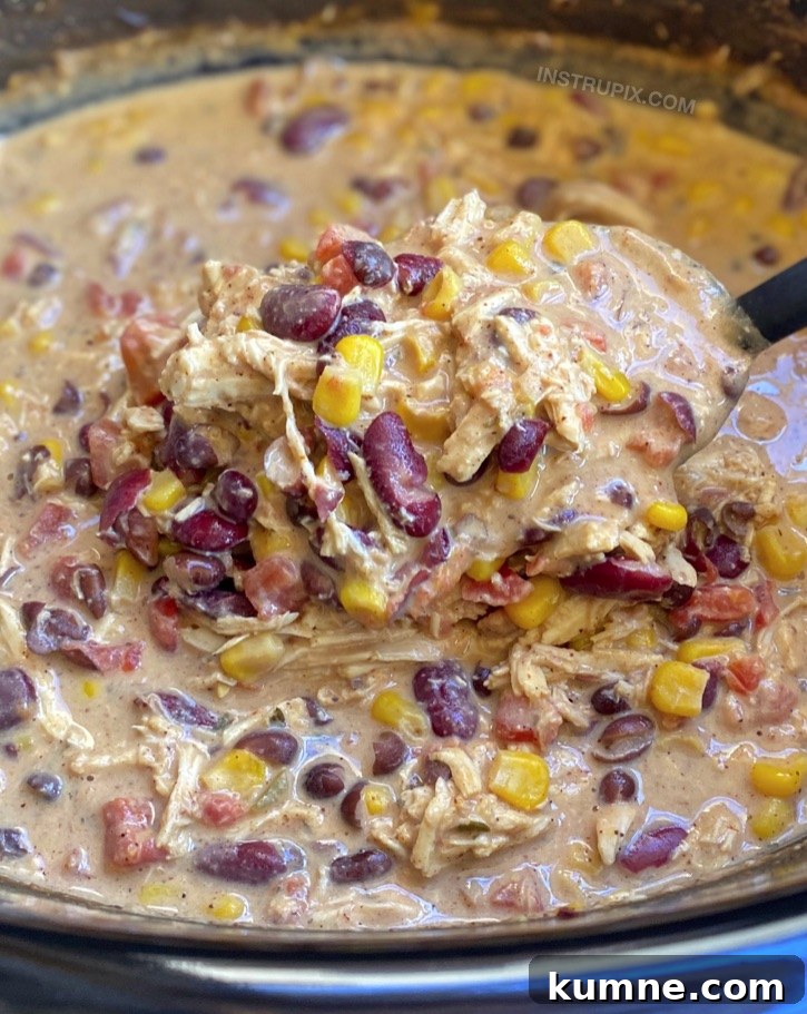Easy slow cooker dinner recipe made with chicken and cream cheese! This creamy white chicken chili is a family favorite. Even my picky kids love it! Some serious comfort food in the cold winter months!