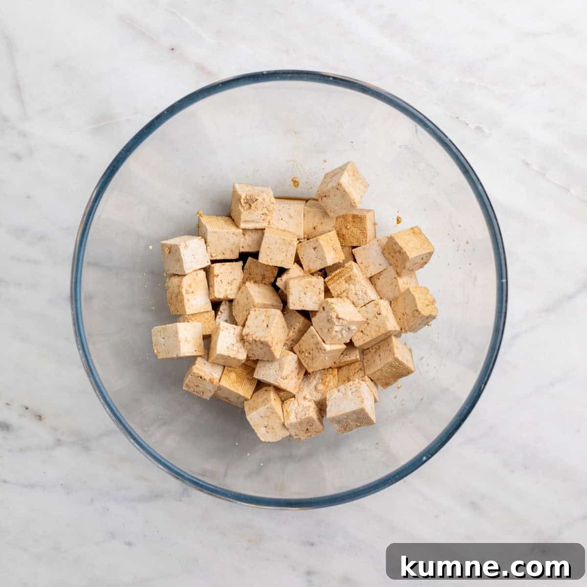 Tofu cubes in a bowl with soy sauce and vinegar